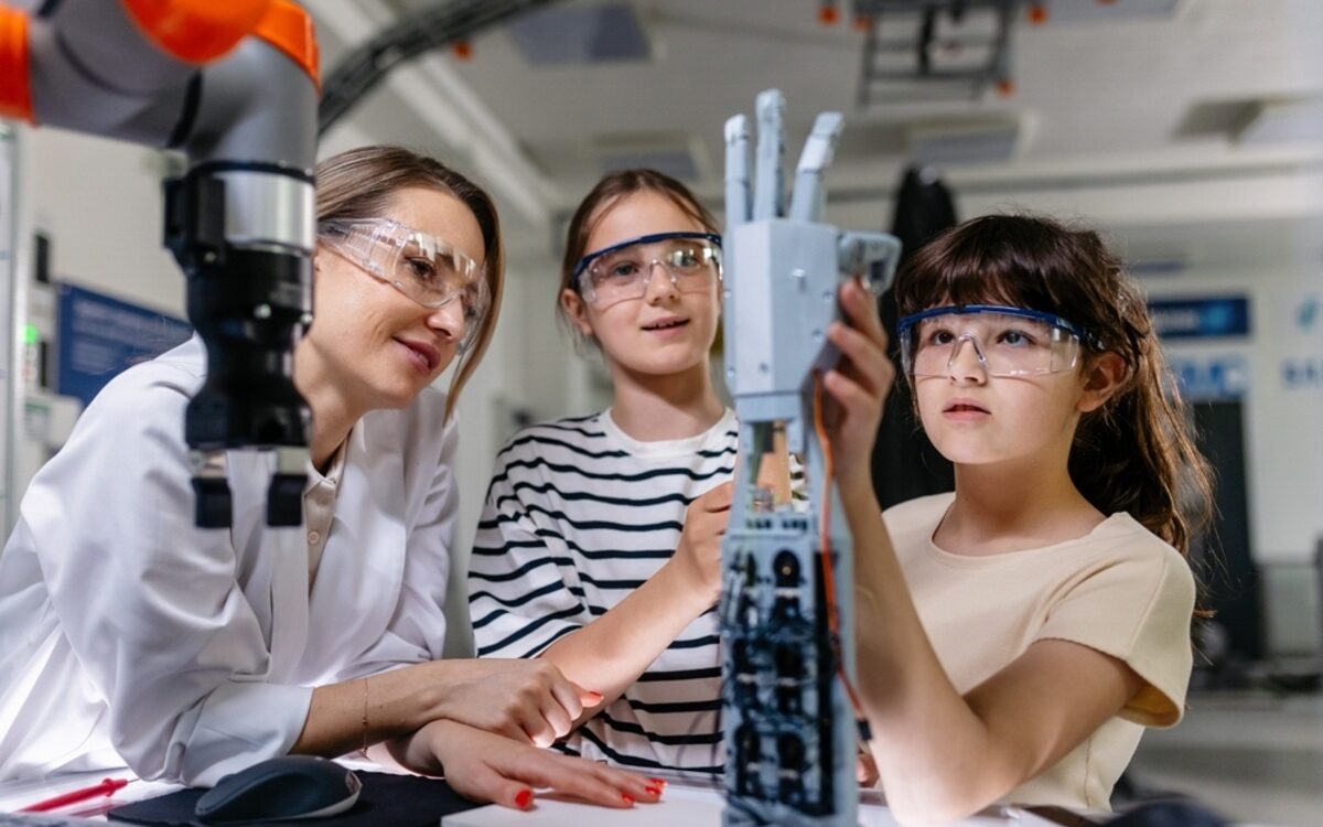 Children learning engineering and robotics demonstrating STEM skills in the real world