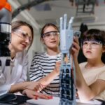 Children learning engineering and robotics demonstrating STEM skills in the real world