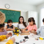 Elementary students and teacher collaborating on a robotics project representing hands-on STEM projects for elementary students in action