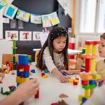 Preschool children building block towers during play-based STEM learning activity